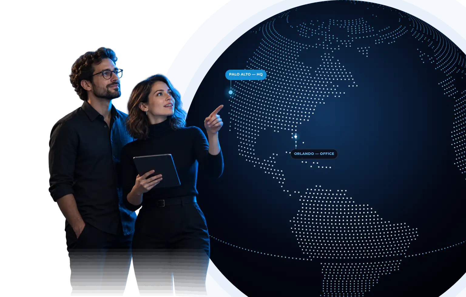 Two LITSLINK engineers looking at a globe with the company offices and client locations