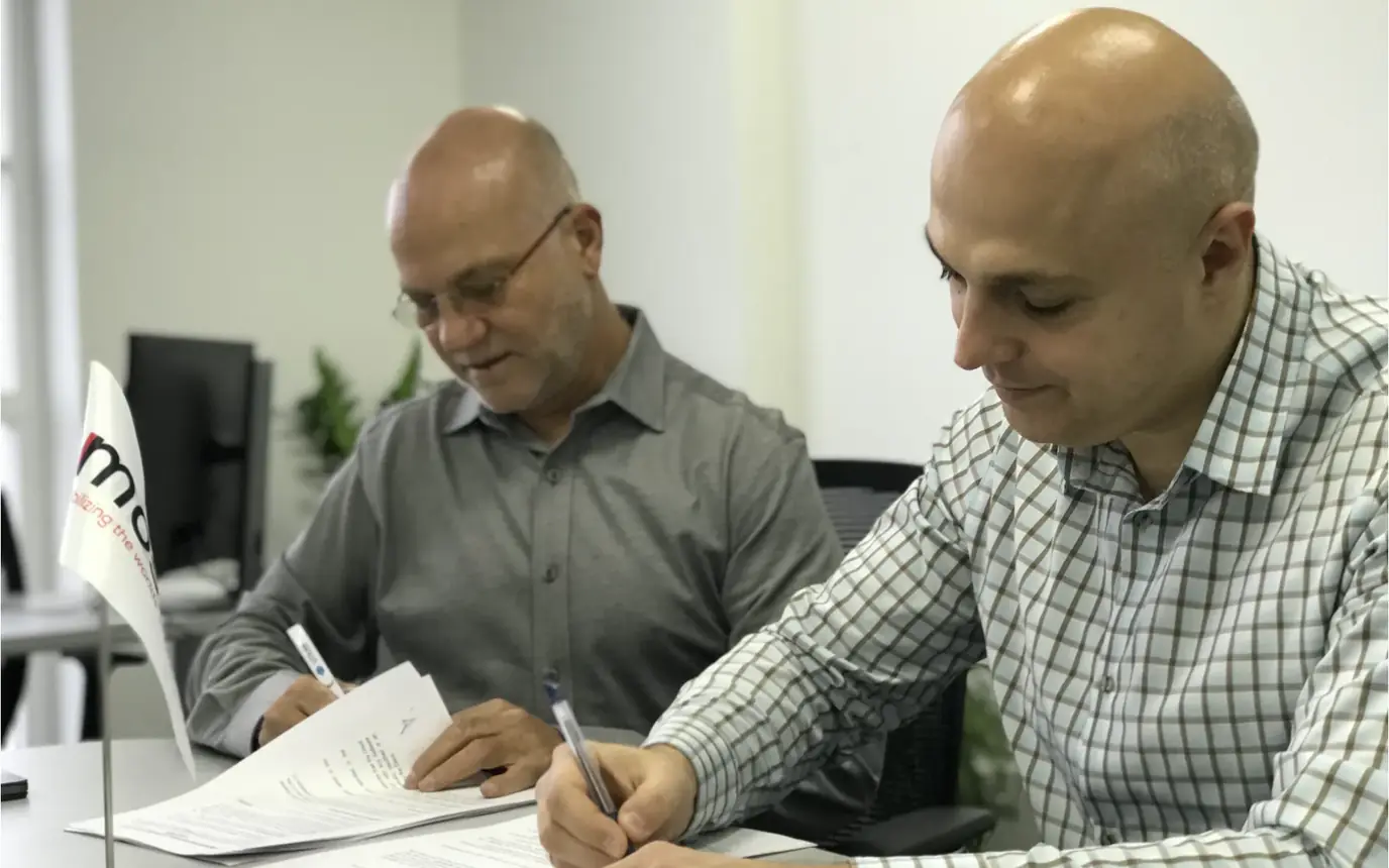 LITSLINK and a client signing a partnership agreement