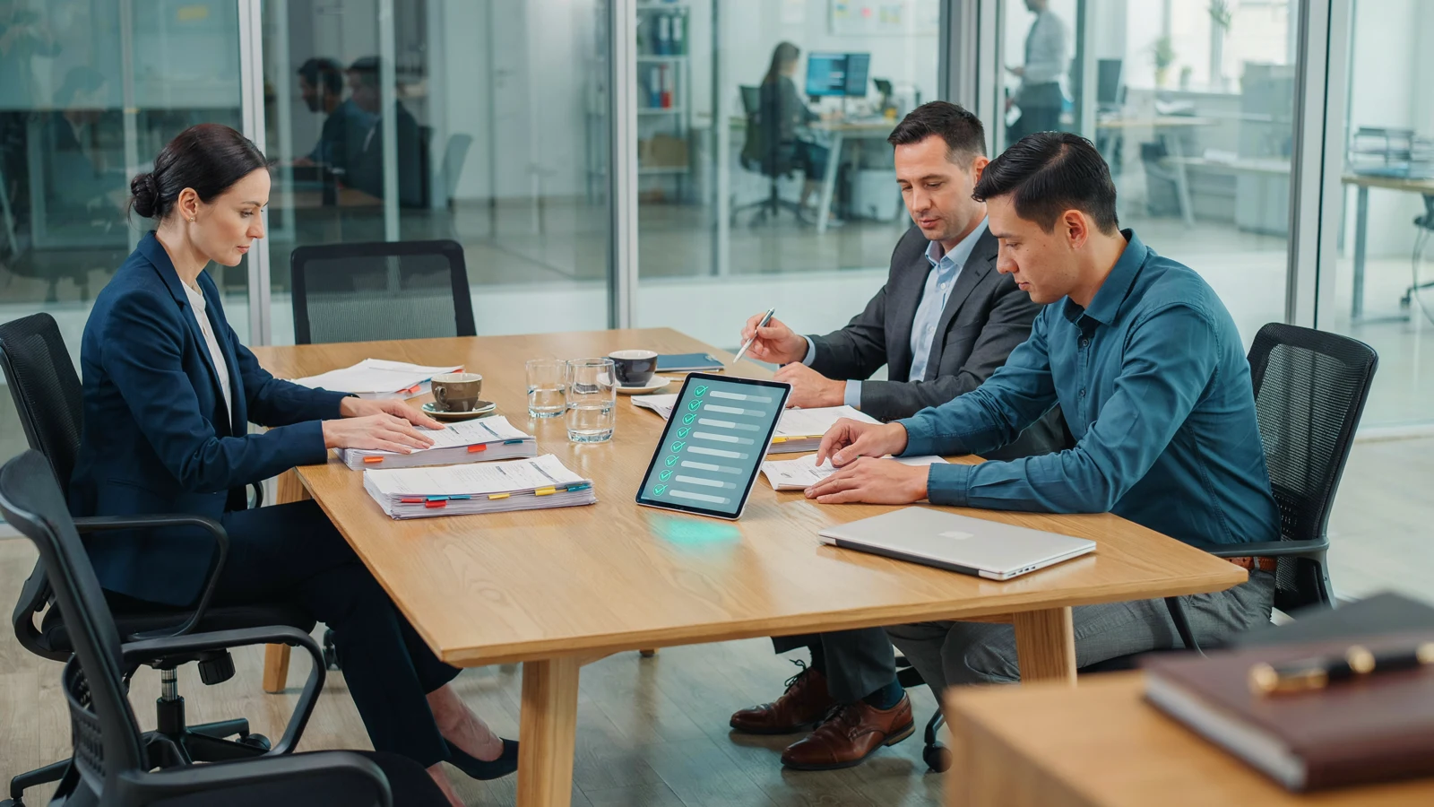 Regulatory affairs team reviewing FDA and EMA validation documents for AI drug development