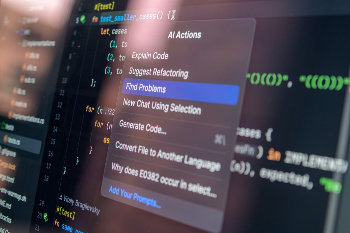 A code editor with an 'AI Actions' menu — Explain Code, Suggest Refactoring, Find Problems, Generate Code.