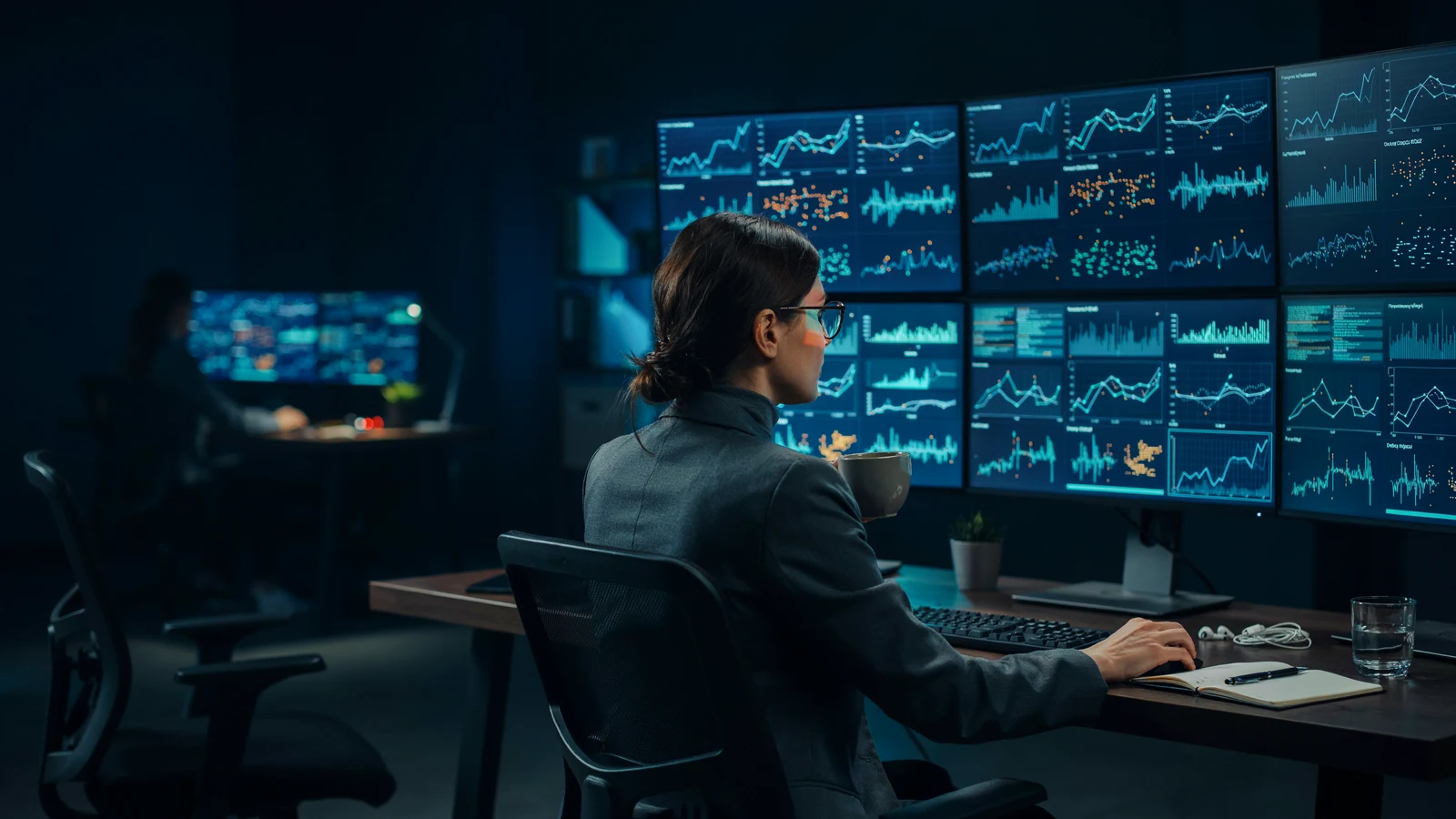 Drug safety analyst tracking adverse event signals on a monitoring wall, showing AI in pharmacovigilance