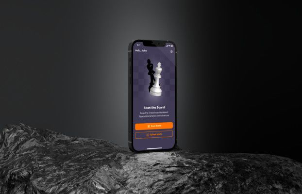 Phone showing a chess app's Scan the Board screen with chess pieces and Scan Board and Upload photo buttons
