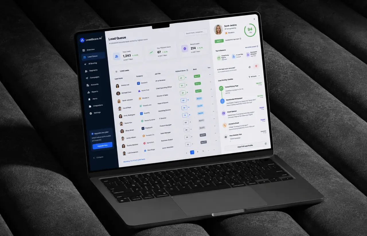 Laptop showing the LeadScore AI lead queue with ranked leads, their scores and status badges