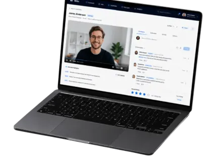 Willo recruiter dashboard on a laptop showing a candidate's video interview with team comments, evaluation tabs and an overall star rating