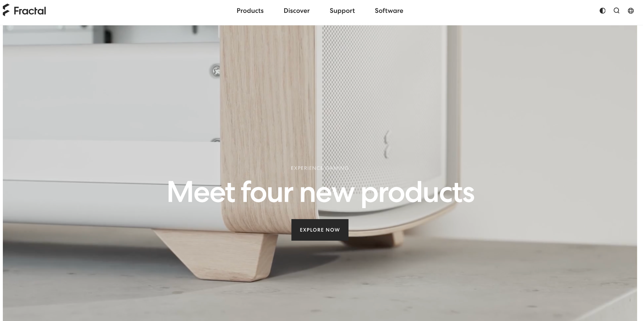 Fractal Design homepage showing a white and wood PC case with the heading "Meet four new products" and an Explore Now button.
