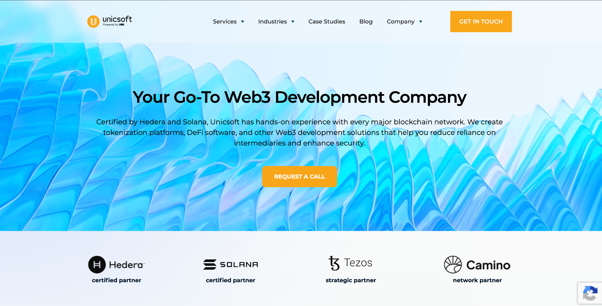 Unicsoft homepage: "Your Go-To Web3 Development Company" over a blue wave graphic, with Hedera, Solana, Tezos and Camino partner badges.