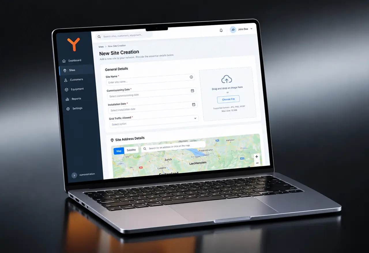 Laptop screen for creating a new solar site: site name, commissioning and installation dates, grid traffic, an image upload and the site address on a map