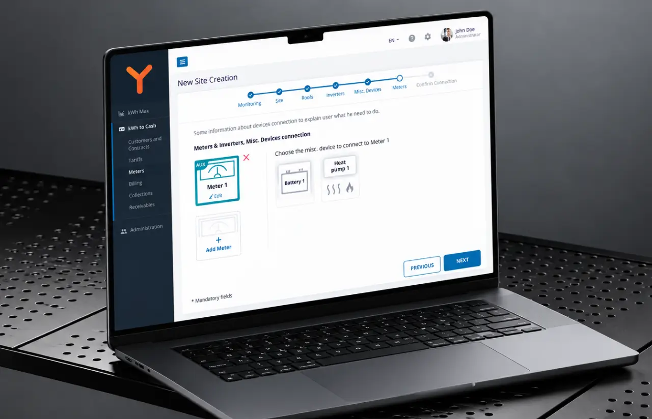 Laptop screen with the new site wizard at the meters step: a stepper through monitoring, site, roofs, inverters, devices and meters, and a meter being connected to a battery and a heat pump