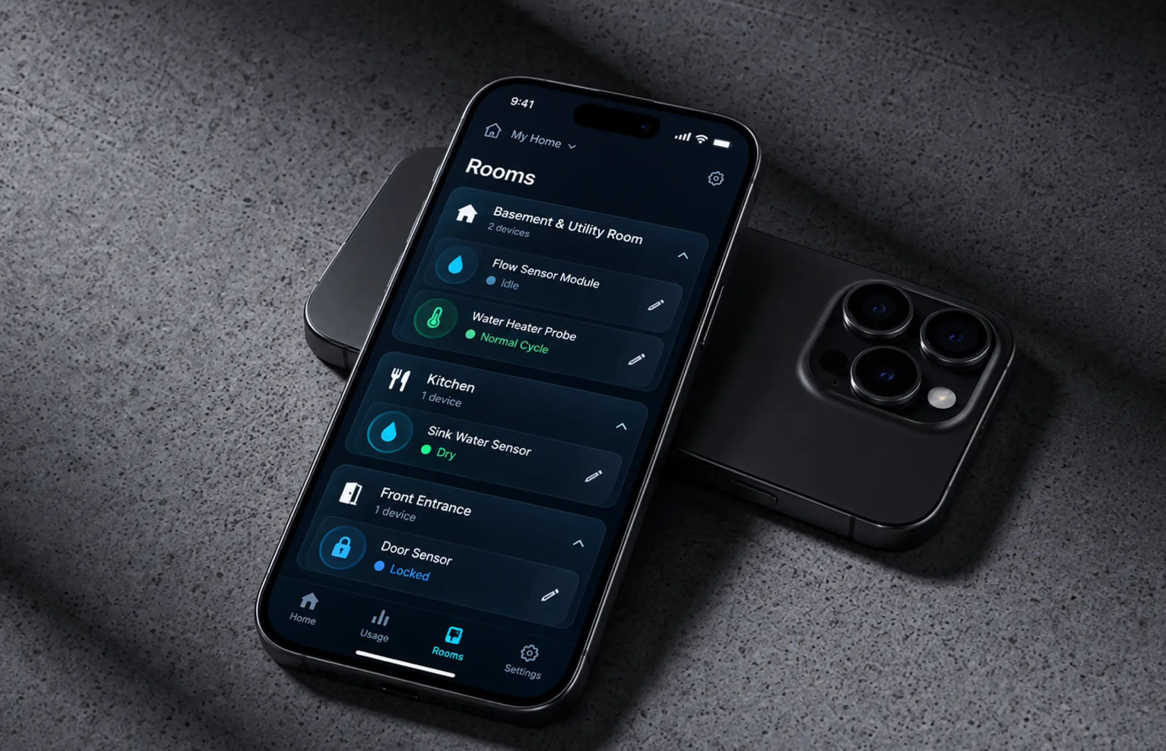 Phone on a dark surface showing the Rooms tab with flow sensor, water heater probe, sink water sensor and door sensor rows, each with a status dot and an edit button