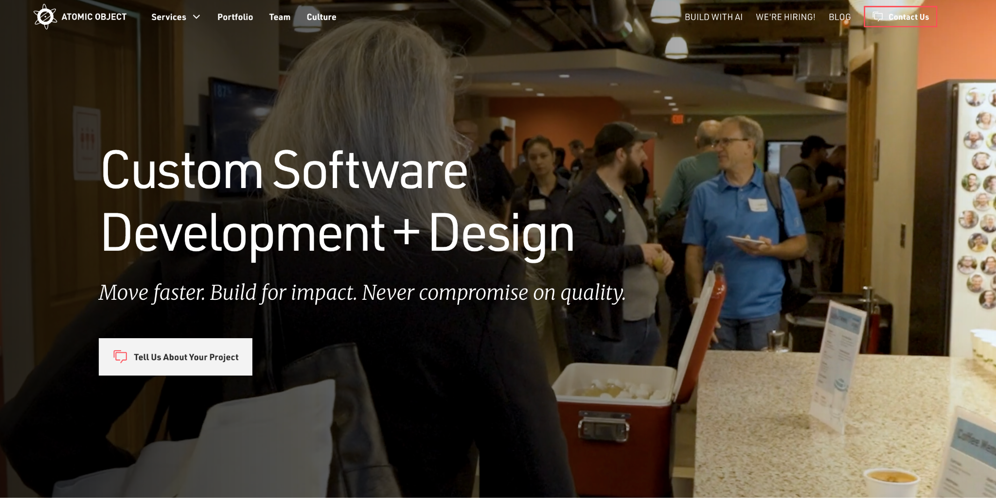 Atomic Object homepage: 'Custom Software Development + Design' headline over a photo of the team in its office