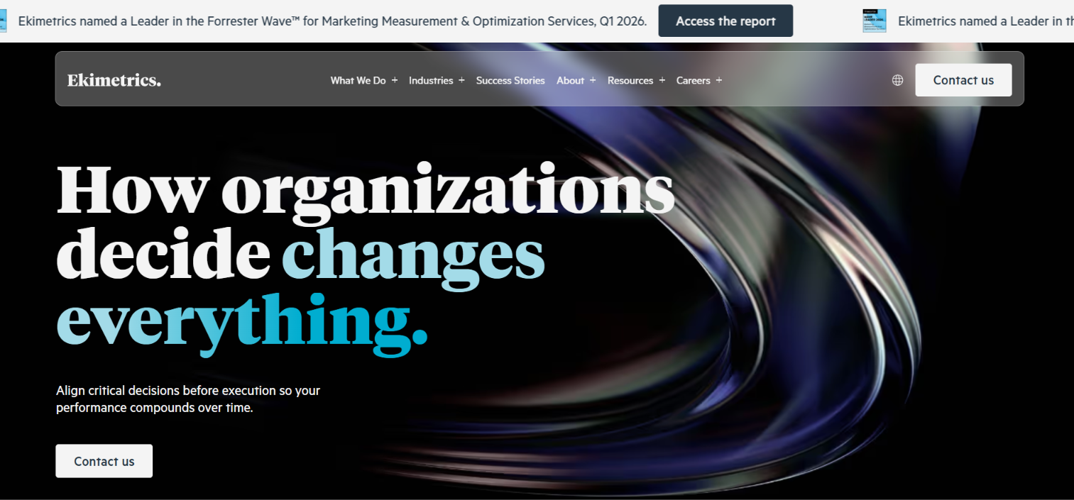 Ekimetrics homepage headlined How organizations decide changes everything, with a banner naming it a Forrester Wave leader for Q1 2026.
